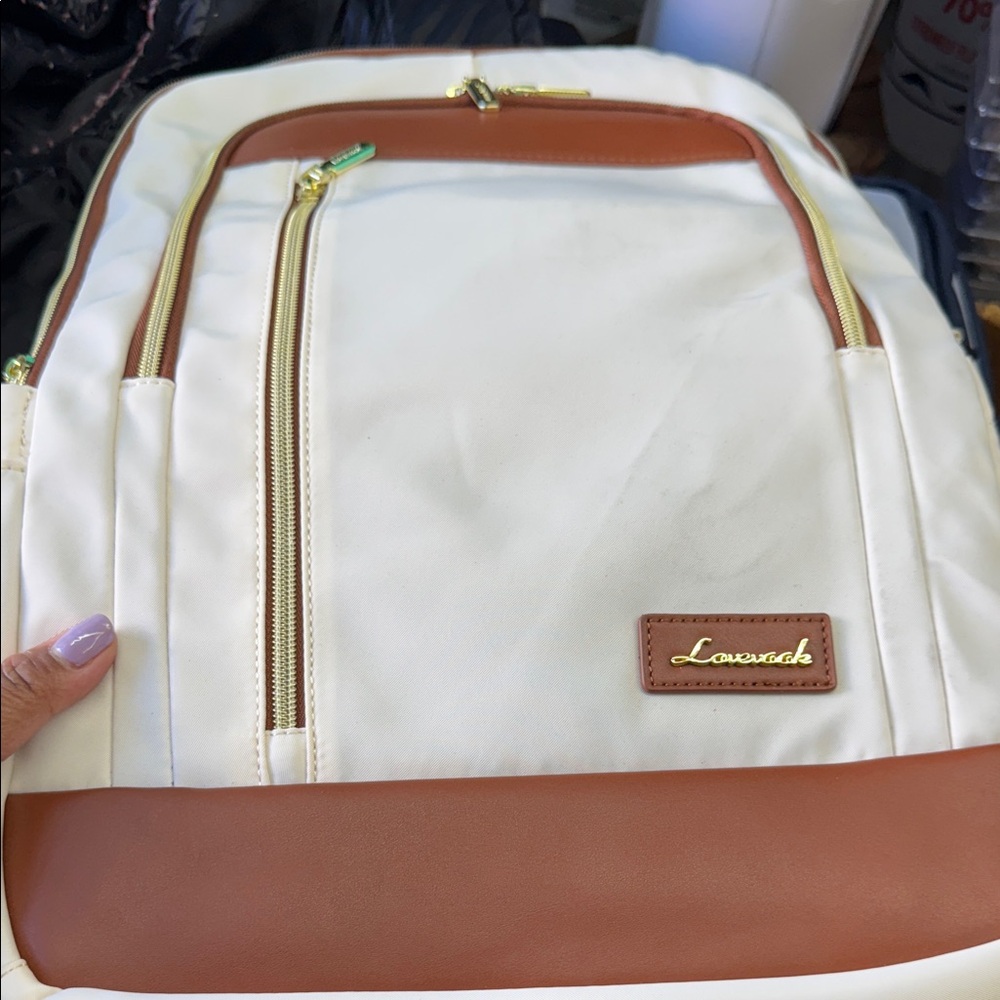 Lacoste Cream and Tan Backpack with Gold Accents